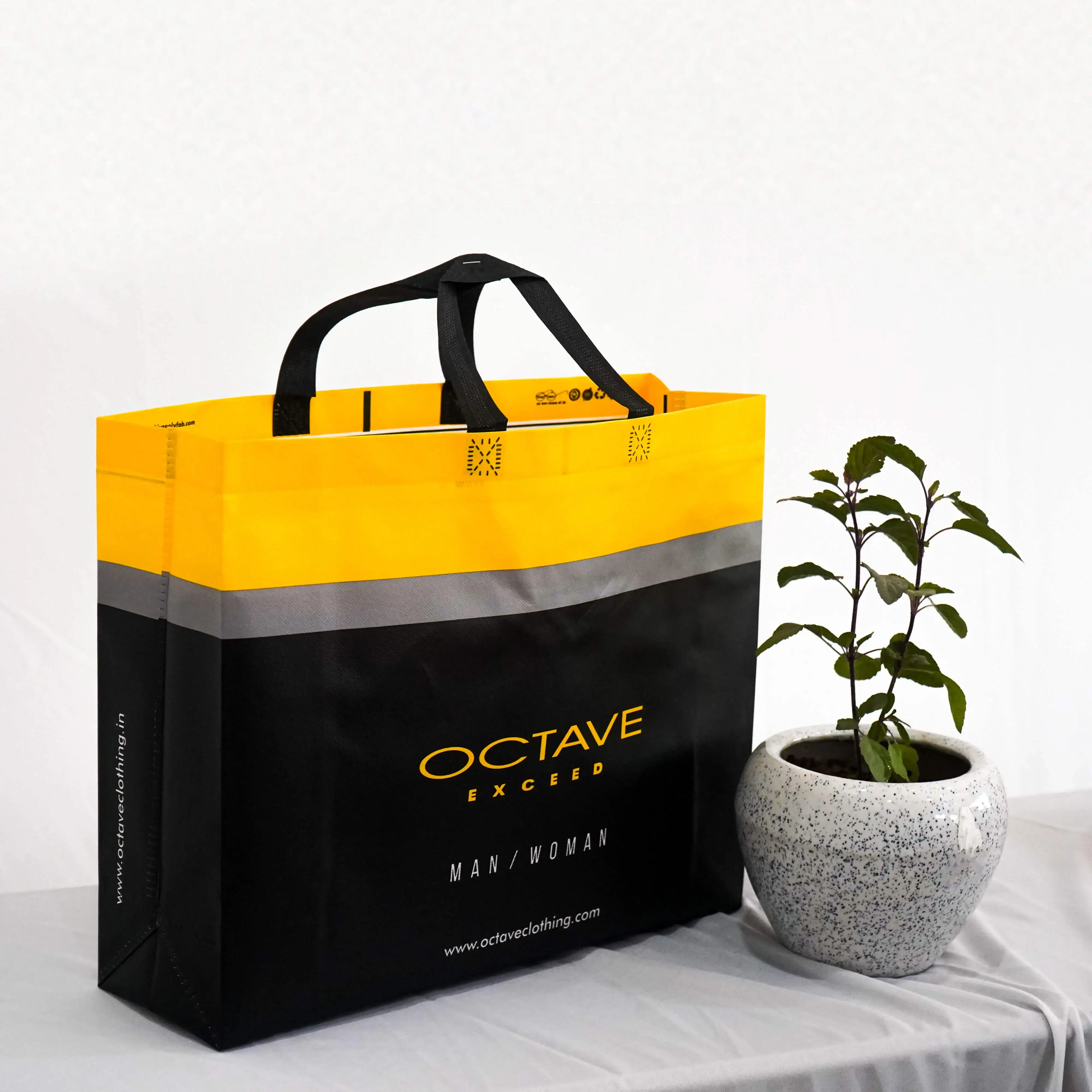 Custom printed non-woven bag for Octave Exceed, black and yellow design